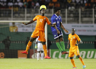 Sierra Leone's Michael Lahoud (blue uniform) leaps for the ball in a Nations Cup qualifying match in Abdijan, Ivory Coast. Photo: Reuters