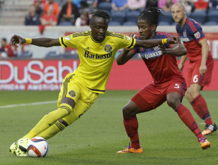 Kei Kamara (L) dribbles in a match against the Chicago Fire. Photo: AP