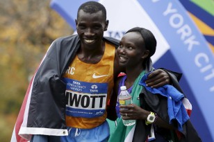 Kenyan athletes Simon Biwott and Mary Keitany celebrate their titles at the New York City Marathon November 1. Photo: Mike Segar/Reuters