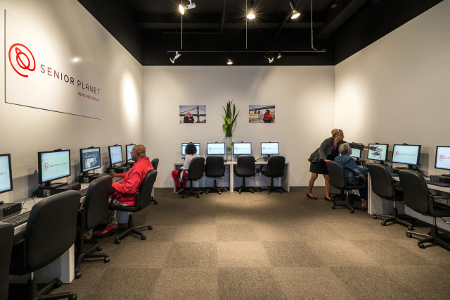 Instructors and students interact at the Senior Planet Exploration Center in New York, the first of its kind for free technology education for older adults. (OATS/Evan Joseph Images)