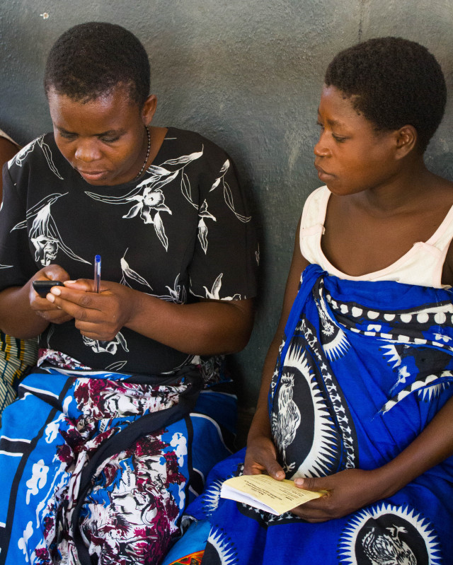 A community health worker registers a pregnant mother for ANC Connect at Kasinje Health Center in Malawi. (Jodi-Ann Burey)