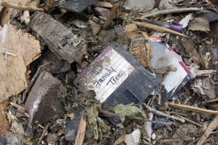 A computer disk with family tree information lies among rubble on May 26, 2011, in Joplin, Mo., after a tornado tore through much of the city. (AP)
