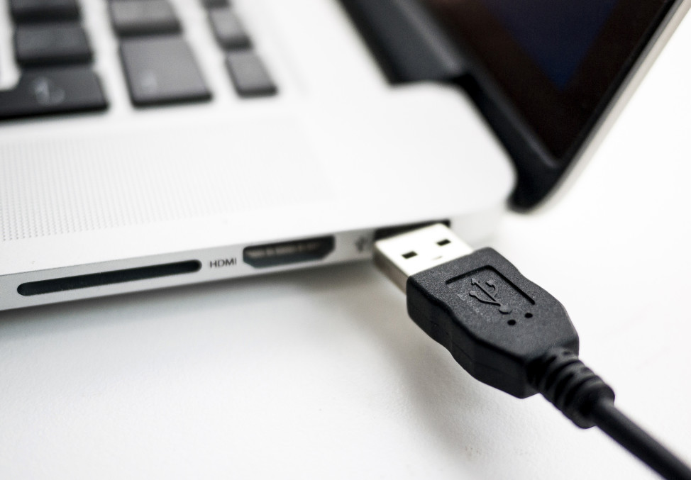 FILE - A photo illustration shows a USB device being plugged into a laptop computer in Berlin, Germany, (Reuters)