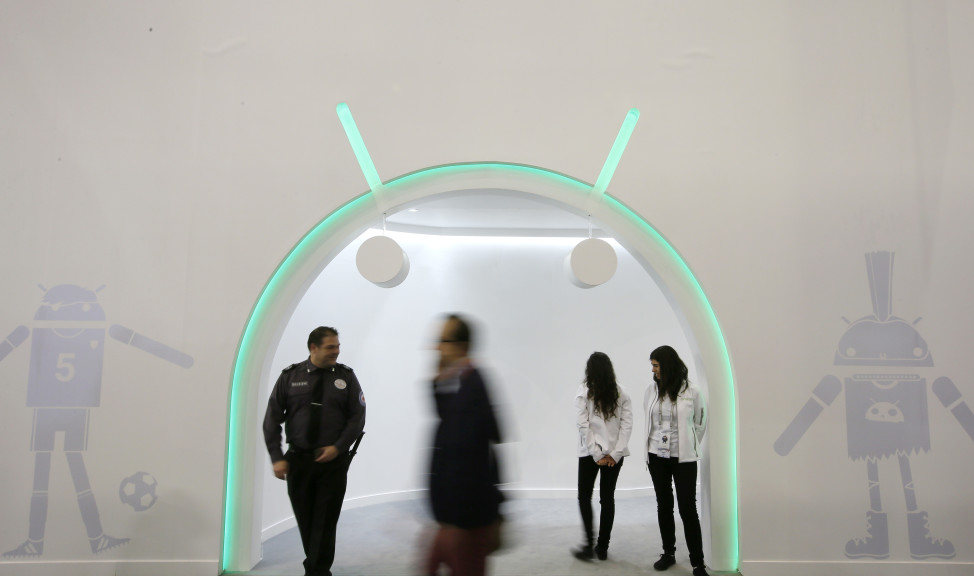 A man walks past the Android entrance stand during the Mobile World Congress in Barcelona, Spain, Feb. 24, 2016. 