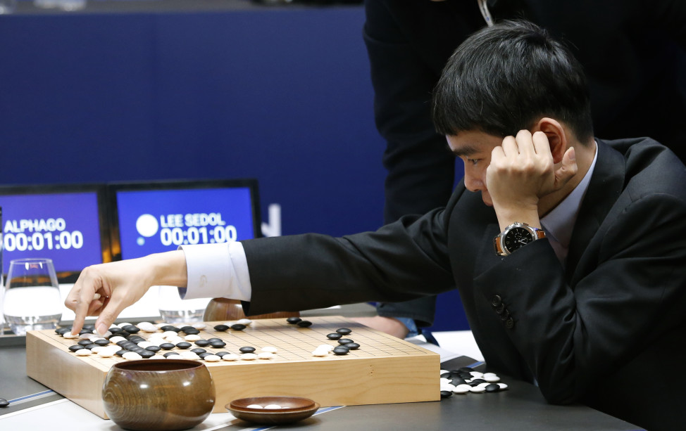 South Korean professional Go player Lee Sedol reviews the match himself after losing the second match of the Google DeepMind Challenge Match to Google's artificial intelligence program, AlphaGo in Seoul, South Korea, March 10, 2016. (AP)