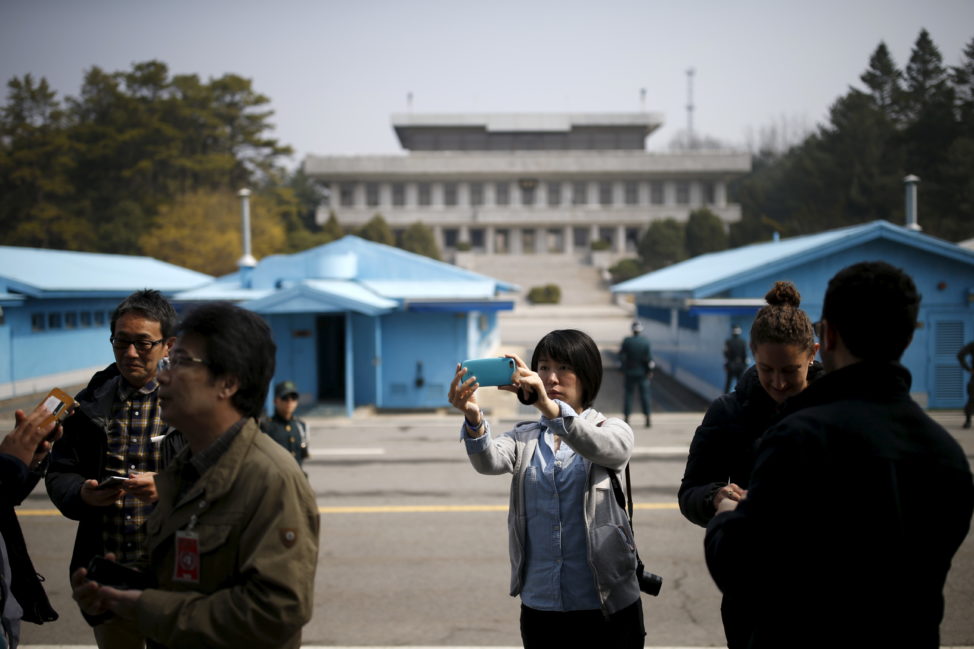 A foreign tourist takes a selfie at the truce village of Panmunjom, South Korea, March 30, 2016. (Reuters)