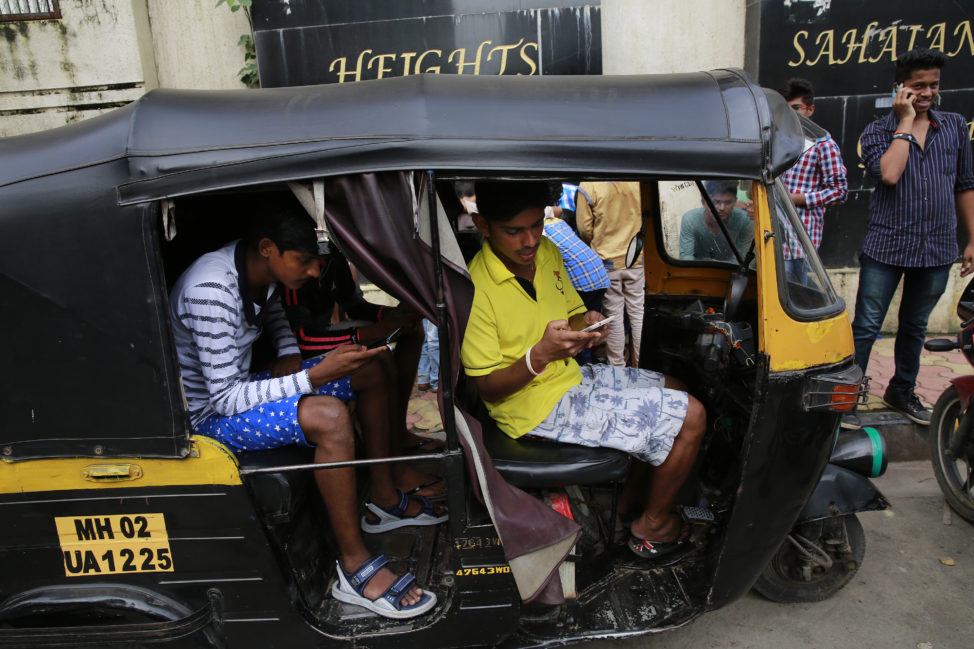 FILE - Indians play 'Pokémon GO' inside an autorickshaw in Mumbai, July 24, 2016. (AP)