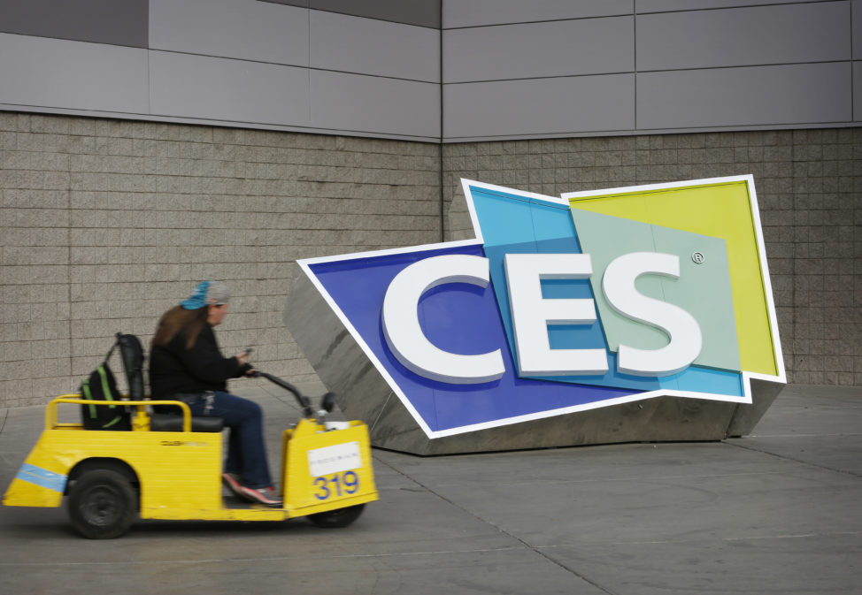 FILE - A worker drives by a sign at the Las Vegas Convention Center before the start of the International CES gadget show, Jan. 3, 2016, in Las Vegas. (AP)