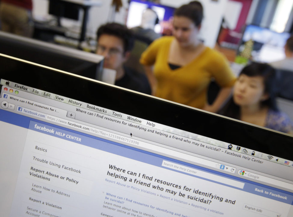 FILE - Facebook's User Operations Safety Team workers look at reviews at Facebook headquarters in Menlo Park, California. (AP)