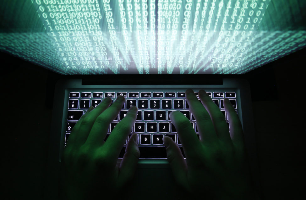 FILE - An illustrations shows a man typing on a computer keyboard in Warsaw, Poland. (Reuters)