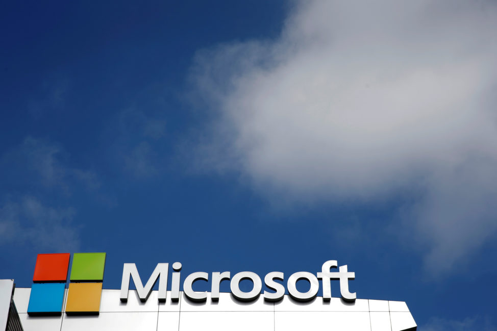 FILE - A Microsoft logo is seen next to a cloud in Los Angeles, California. (Reuters)