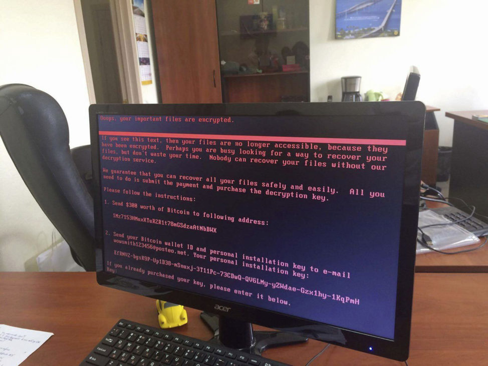 A computer screen shows a cyberattack warning notice reportedly holding computer files to ransom, as part of a massive international cyberattack, Kyev, Ukraine. (AP)
