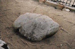 There’s probably another myth lurking in the story of the Pilgrims.  Although they did land in Plymouth, it probably wasn’t on this very “Plymouth Rock” of legend, preserved as a tourist attraction.  In fact, it was likely clear across Cape Cod Bay, in what became Provincetown. (Library of Congress)