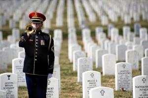 A bugler sounds “Taps” during a burial ceremony at Arlington.  (Beverly & Pack, Flickr Creative Commons)