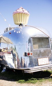 Airstreams and motor homes are often put to “adaptive reuse.”  This one is now the home of a cupcake-sales operation.  (B*2, Flickr Creative Commons)