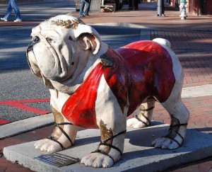 There has been a long success of “Uga” bulldog mascots.  Uga, as in “University of Georgia.”  Perhaps instead of clobbering other teams, the Bulldogs slobber them.  (hyku, Flickr Creative Commons)