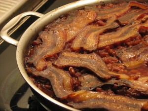 You can almost taste these homemade Boston baked beans.  Like this cook, I think the bacon or pork is the secret, delectable ingredient.  (peppergrasss, Flickr Creative Commons)