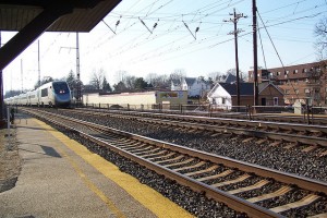 You can see at least some of the Acela Express's trainset as it passes through a suburban Philadelphia station.  (jpmueller99, Flickr Creative Commons)