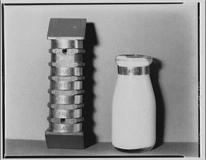 A returnable milk bottle, circa 1920, with a stack of day-of-the-week bands to identify the vintage of its contents.  (Library of Congress)