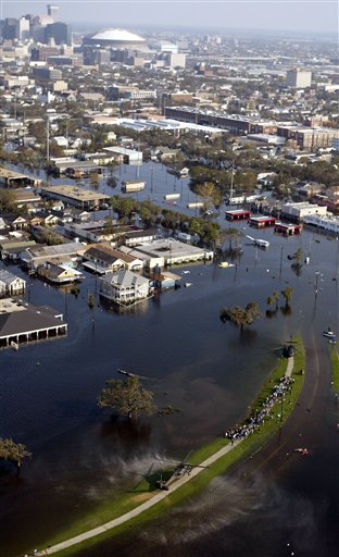 People await rescue on precious high ground, lower right, August 31, 2005.  (AP Photo/David J. Phillip)