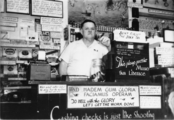 This looks like a more svelte Oliver at the cash register in Wintzell's early days.  His slogans were everywhere even then.  (Wintzell's)