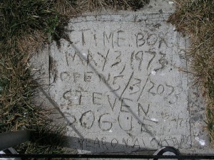 Here's the marker for what is, no doubt, a crude time capsule, buried in 1973 at the super-max-security Alcatraz Prison in San Francisco Bay.  The inmate who buried the capsule wishes it opened in 2073.  (inajeep, Flickr Creative Commons)