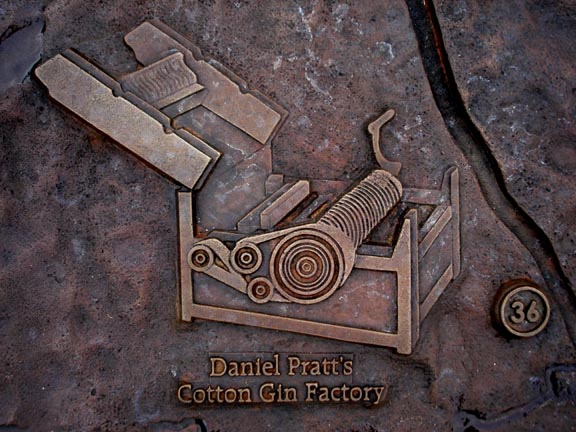 A small part, recognizing Prattville's gin factory, of a bronze map on the lawn in front of the Alabama Archives building in Montgomery.  (Alabama Department of Archives and History)