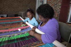 A Gees Bend quilter and her "helper."  (Carol M. Highsmith)