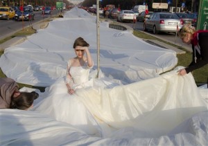 This photo of Emma Dumitrescu, 17, in Bucharest, Romania, isn't large enough to see ALL of her world-record bridal-gown train.  (Vadim Ghirda/AP Photo)