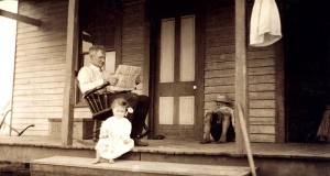 OK, scenes such as this were captured almost a century ago.  But the pleasure of a good newspaper "read" endured until the Digital Age got it in a death grip.  (Library of Congress) 