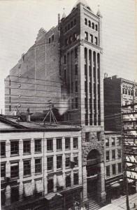 The skinny Tower Building is the central portion, with the archway at street level. It's long gone from the streetscape. (nyc-architecture.com)