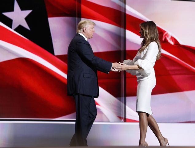 Melania Trump greets her husband Republican U.S. presidential candidate Donald Trump onstage at the Republican National Convention in Cleveland, Ohio, U.S. July 18, 2016. REUTERS/Mark Kauzlarich - RTSIMGH