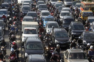 Vehicles are seen stuck in a traffic jam during rush hour in Jakarta