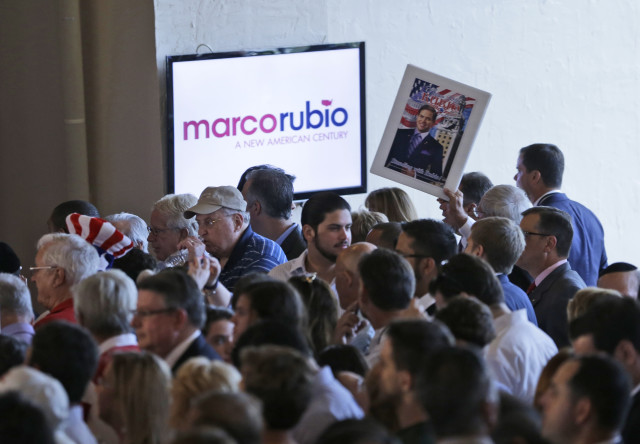 Supporters of Florida Sen. Marco Rubio wait for him to appear during a rally at the Freedom Tower on April 13, 2015, in Miami. (AP/Wilfredo Lee)