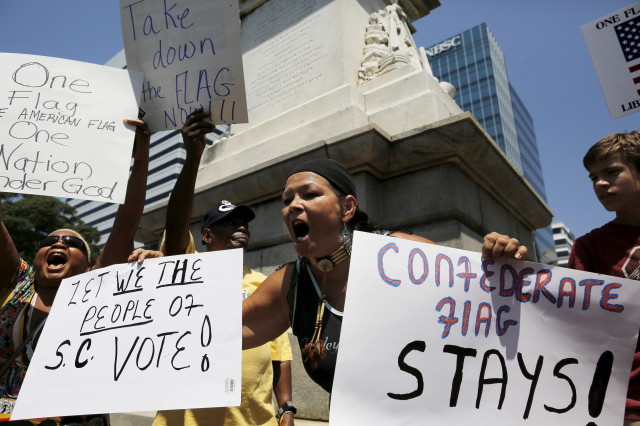 Sky Eyes, who supports keeping the Confederate flag outside the State House, argues with opponents during a rally to remove the Confederate flag in Columbia, South Carolina on June 23, 2015. (Reuters)