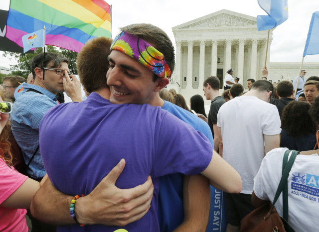 Gay rights supporters celebrate after the U.S. Supreme Court ruled that the U.S. Constitution provides same-sex couples the right to marry, outside the court in Washington on June 26, 2015. (Reuters)