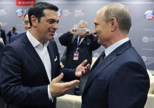Russian President Vladimir Putin, right, and Greek Prime Minister Alexis Tsipras speak at an economic forum in St. Petersburg, Russia on June 19, 2015