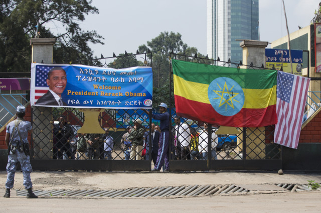 Security personal stand along the motorcade route of President Barack Obama as he drives to the National Palace to meet with Ethiopian Prime Minister Hailemariam Desalegn, on  July 27, 2015 in Addis Ababa.