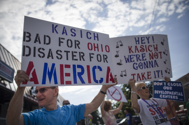 Protestors against Ohio Gov. John Kasich gather outside the Ohio State University student union where he is to announce he is running for the 2016 Republican party'’s nomination for president on July 21, 2015 in Columbus. (AP)