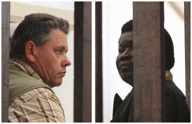 Zimbabwean safari operator Honest Ndlovu (R) and fellow countryman and hunter Theo Bronkhorst waiting to appear in Hwange magistrates court, July 29, 2015. The two Zimbabwean men were paid $50,000 by an American hunter who killed 'Cecil', the country's best-known lion, face charges of poaching. July 29, 2015 (Reuters) 