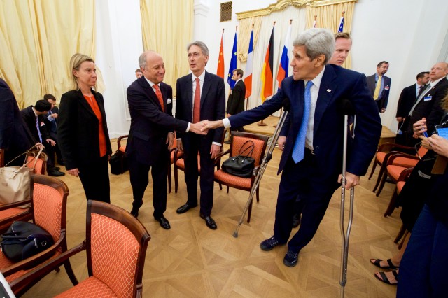 U.S. Secretary of State John Kerry shakes hands with French Foreign Minister Laurent Fabius before the resumption of nuclear talks with Iran in Vienna July 10, 2015. (State Dept. photo/Flickr)  