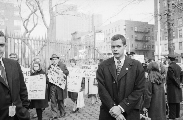 Julian Bond of Georgia, 26, watches as people stream into the St. Mark's Church-on-the-Bouwerie to hear him speak in New York, Feb. 10, 1966. (AP)