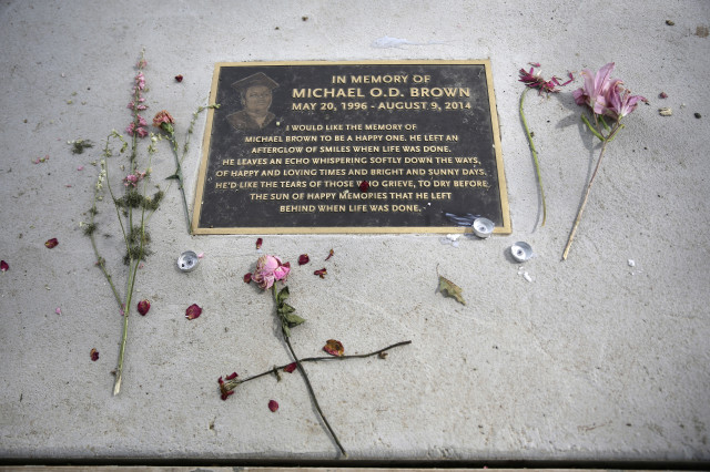 A memorial in a sidewalk near where Michael Brown was shot and killed is pictured on Aug. 8, 2015 in Jennings, Mo. 