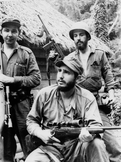 Castro, the young anti-Batista guerilla leader, center, is pictured with his brother Raul Castro, left, and another revolutionary, right, in the mountains of eastern Cuba in 1957.   (AP)