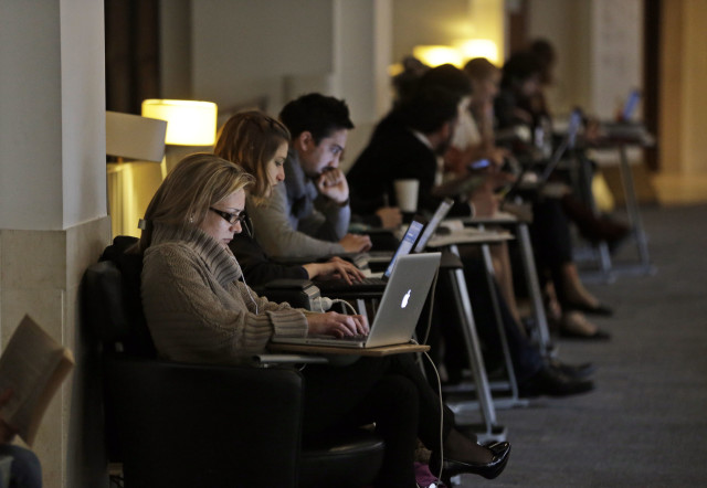 People work on their computers at the British Library in London in this 2013 file photo. (AP)
