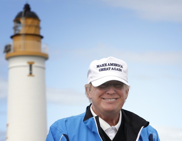 Presidential contender Donald Trump poses for the media during the third day of the Women's British Open golf championship on the Turnberry golf course in Scotland, Aug. 1, 2015. (AP)