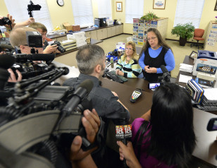 Rowan County Clerk Kim Davis, right, talks with David Moore following her office's refusal to issue marriage licenses at the Rowan County Courthouse in Morehead, Ky., Sept. 1, 2015. (AP)