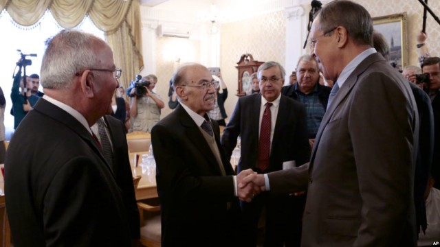 Russian Foreign Minister Sergey Lavrov, right, shakes hands with members of the Syrian delegation prior to a meeting with Qadri Jamil, former deputy prime minister representing Syria's opposition Popular Front of Change and Liberation, in Moscow, Aug. 31, 2015. (AP)