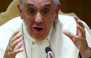 Pope Francis gestures as he speaks during the "Modern Slavery and Climate Change" conference at the Vatican July 21, 2015. (Reuters)