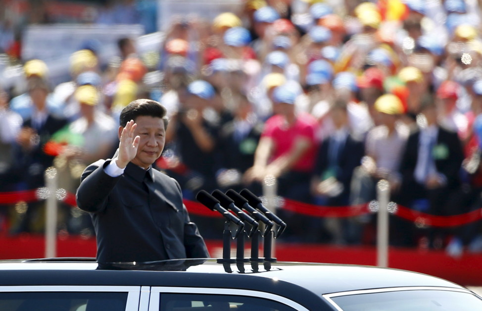 Chinese President Xi Jinping waves at the beginning of the military parade marking the 70th anniversary of the end of World War II in Beijing on Sept. 3, 2015. (Reuters)